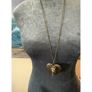 brass-tone heart-shaped padlock pendant with an accompanying key charm